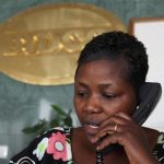 A receptionist speaks on the telephone at a factory in Kenya, January 21, 2012. REUTERS/Noor Khamis