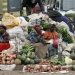 Women sell vegetables and fruits on the roadside in Nairobi, Kenya, June 19, 2008. REUTERS/Antony Njuguna
