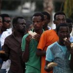 African refugees and migrant workers stand in a charity food line in south Tel Aviv June 11, 2012. REUTERS/Baz Ratner