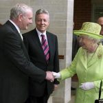 Britain's Queen Elizabeth shakes hands with Northern Ireland deputy first minister Martin McGuinness,