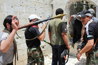 Syrian rebels holding their weapons as they prepare to fight against Syrian troops, in Homs province. Syrian rebels holding their weapons as they prepare to fight against Syrian troops, in Homs province.
