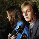 Music recording artist Paul McCartney is interviewed as he arrives for the world premiere of the video "My Valentine" directed by Paul McCartney in West Hollywood, California April 13, 2012. REUTERS/Mario Anzuoni