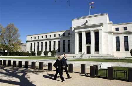 Pedestrians walk past the Federal Reserve Building in Washington Pedestrians walk past the Federal Reserve Building in Washington April 3, 2012. REUTERS/Joshua Roberts
