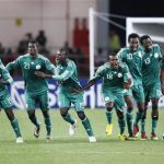 Nigeria team players celebrate winning their Africa Nations Cup quarter finals match against Zambia on a penalty shoot out in Lubango, January 25, 2010. REUTERS/Finbarr O'Reilly