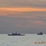 A handout photo shows two Chinese surveillance ships which sailed between a Philippines warship and eight Chinese fishing boats to prevent the arrest of any fishermen in the Scarborough Shoal, a small group of rocky formations whose sovereignty is contested by the Philippines and China, in the South China Sea, about 124 nautical miles off the main island of Luzon in this April 10, 2012 file photo. REUTERS/Philippine Army/Handout/Files