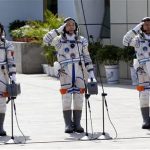 Chinese astronauts Jing Haipeng (C), Liu Wang ( R) and Liu Yang, China's first female astronaut, salute during a departure ceremony at Jiuquan Satellite Launch Center, Gansu province, June 16, 2012. REUTERS/Jason Lee