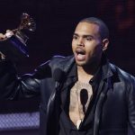 Chris Brown accepts the award for best R&B album for "F.A.M.E." at the 54th annual Grammy Awards in Los Angeles, California, February 12, 2012. REUTERS/Mario Anzuoni