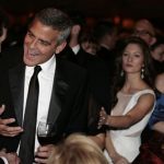 Actor George Clooney (2nd L) talks before the White House Correspondents' Association annual dinner in Washington April 28, 2012. REUTERS/Larry Downing