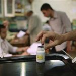 A voter dips his finger in a bottle of ink after casting his vote at a polling station in Cairo June 17, 2012. REUTERS/Suhaib Salem