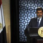 Muslim Brotherhood's president-elect Mohamed Morsy speaks during his first televised address to the nation at the Egyptian Television headquarters in Cairo June 24, 2012. REUTERS/Stringer