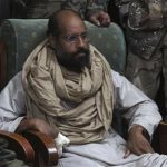 Saif al-Islam is seen after his capture, in the custody of revolutionary fighters in Obari, Libya, November 19, 2011. REUTERS/Ammar El-Darwish