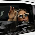 U.S. singer Lady Gaga waves to fans upon arriving at the JetQuay CIP (Commercially Important People) terminal at Changi Airport in Singapore May 26, 2012. REUTERS/Tim Chong