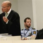 Defense lawyer Geir Lipepstad, left, gives his final statement in court during the trial of terror charged Anders Behring Breivik, right, in Oslo, Friday, 22 June, 2012. On the last day of his trial, Anders Behring Breivik's defense lawyers on Friday tried to cast the confessed mass killer as a political militant motivated by an extreme right-wing ideology rather than a delusional madman who killed 77 people for the sake of killing. (AP Photo/Heiko Junge/pool)