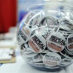 Buttons reading 'Repeal Obamacare' are displayed at the American Conservative Union's annual Conservative Political Action Conference (CPAC) in Washington, February 9, 2012. REUTERS/Jonathan Ernst
