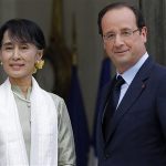 Myanmar pro-democracy leader Aung San Suu Kyi (L) is welcomed by French President Francois Hollande as she arrives on the first day of a three-day visit at the Elysee Palace in Paris June 26, 2012. REUTERS/Gonzalo Fuentes