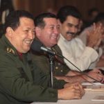 Venezuela's President Hugo Chavez (L) smiles during a meeting with military members in Caracas June 13, 2012. Picture taken June 13, 2012. REUTERS/Miraflores Palace/Handout