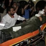 A wounded member of Hamas' security forces is wheeled into al-Shifa hospital after Israeli air raids hit Hamas security sites in Gaza City June 23, 2012. REUTERS/Ahmed Zakot