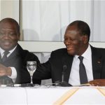 Ivory Coast's President Alassane Ouattara (R) smiles next to Interior Minister Hamed Bakayoko during a news conference in Man, in the west of Ivory Coast April 24, 2012. REUTERS/Thierry Gouegnon