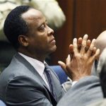 Dr. Conrad Murray sits in court after he was sentenced to four years in county jail for his involuntary manslaughter conviction of pop star Michael Jackson in Los Angeles November 29, 2011. REUTERS/Mario Anzuoni