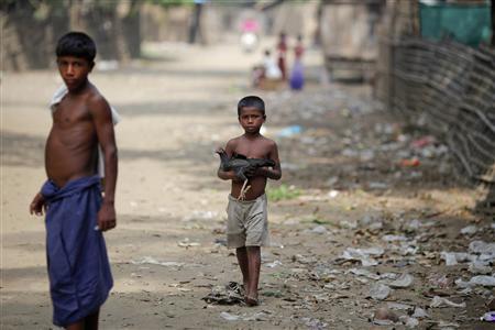 A Myanmar Rohingya boy carries a chicken in the village of Gollyadeil A Myanmar Rohingya boy carries a chicken in the village of Gollyadeil, north of the town of Sittwe May 18, 2012. REUTERS/Damir Sagolj