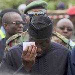 Nigeria's President Goodluck Jonathan wipes a tear after he arrived to inspect the site of a plane crash at Iju-Ishaga neighbourhood in Lagos June 4, 2012. REUTERS/Akintunde Akinleye
