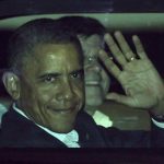 U.S. President Barack Obama waves from his car after landing at the airport in Los Cabos June 17, 2012. REUTERS/Henry Romero