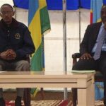 Democratic Republic of Congo's President Joseph Kabila (R) and his Rwandan counterpart Paul Kagame attend a meeting at the Congo-Rwanda border near Goma in eastern Congo, August 6, 2009. REUTERS/John Kanyunyu