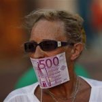 A woman covers her mouth with a fake Euro note during a protest against Spain's bailout at La Constitucion square in Malaga, southern Spain, June 10, 2012. REUTERS/Jon Nazca