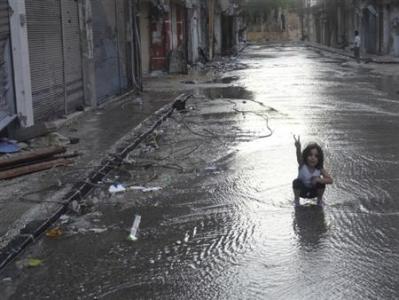 A girl flashes a victory sign in Homs, June 23, 2012. Picture taken June 23, 2012. REUTERS/Waleed Fares/Handout