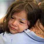 Cali Farmer, 4, (L) cries as she hugs her mother Netta Farmer at California Institute for Women state prison in Chino, California May 5, 2012. REUTERS/Lucy Nicholson