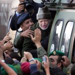 Ailing Palestinian leader Yasser Arafat says goodbye to well-wishers as he leaves Ramallah on October 29, 2004. He was flown to Paris to seek medical treatment, but died less than two weeks late