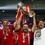 Spain's Fernando Torres, Juan Mata, Sergio Ramos and Andres Iniesta (L-R) lift up the trophy after defeating Italy to win the Euro 2012 final soccer match at the Olympic stadium in Kiev