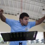 Conductor Jose Angel Salazar, 14, leads the Youth Symphonic Orchestra of the Nueva Esparta state during a rehearsal in Margarita Island June 21, 2012. REUTERS/Carlos Garcia Rawlins