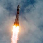 Russian Soyuz rocket rises on a pillar of flame from the Baikonur Cosmodrome in Kazakhstan on Sunday, sending a three-person crew to the International Space Station