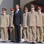 Syria's President Bashar al-Assad (C) stands with leaders of the army, including Fahad Jassim al-Freij (front L) and Daoud Rajha (front R) at the Tomb of the Unknown Soldier in a ceremony to mark the 38th anniversary of the 1973 October War with Israel, in Damascus in this October 6, 2011 file handout photo released to Reuters on July 18, 2012. REUTERS/Sana/Handout/Files