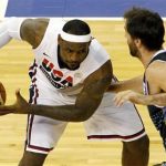 Lebron James (L) of Team USA fights for a ball against Team Argentina's Federico Kammerichs during their men's exhibition basketball game ahead of the London 2012 Olympic Games at Palau Sant Jordi arena, in Barcelona July 22, 2012. REUTERS/Albert Gea