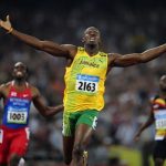 Usain Bolt of Jamaica celebrates winning the men's 200m final of the athletics competition in the National Stadium at the Beijing 2008 Olympic Games, in this August 20, 2008 file photo. REUTERS/Dylan Martinez/Files