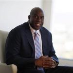 Earvin "Magic" Johnson poses for a portrait at his offices in Beverly Hills, California, June 25, 2012. REUTERS/Mario Anzuoni