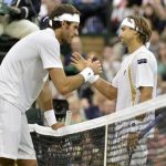 David Ferrer of Spain (R) shakes hands with Juan Martin del Potro of Argentina after defeating him in their men's singles tennis match at the Wimbledon tennis championships in London July 3, 2012. REUTERS/Toby Melville