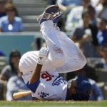 Los Angeles Dodgers' Andre Ethier falls after swinging at a pitch against the Pittsburgh Pirates during the sixth inning of the Dodgers' MLB national league baseball game home opener in Los Angeles April 10, 2012. REUTERS/Danny Moloshok