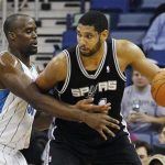 San Antonio Spurs center Tim Duncan (R) works against New Orleans Hornets center Emeka Okafor during the first half of their NBA basketball game in New Orleans, Louisiana January 23, 2012. REUTERS/Bill Haber