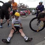 Team Sky rider Mark Cavendish of Britain sits on the ground after a fall during the fourth stage of the 99th Tour de France cycling race between Abbeville and Rouen, July 4, 2012. REUTERS/Joel Saget