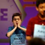 Miles Shebar (L) of New York, waits his turn during round three of the 2011 Scripps National Spelling Bee at the Gaylord National Resort and Convention Center at National Harbor, Maryland, June 1, 2011. REUTERS/Molly Riley