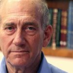 Former Israeli Prime Minister Ehud Olmert gives a statement to the media in Tel Aviv April 15, 2010. REUTERS/Nir Elias