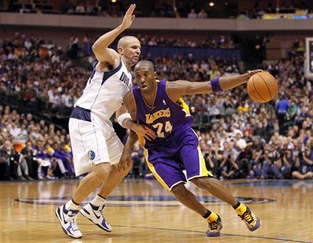 Los Angeles Lakers guard Kobe Bryant (R) drives past Dallas Mavericks guard Jason Kidd during the second half of their NBA basketball game in Dallas, Texas March 21, 2012. REUTERS/Mike Stone