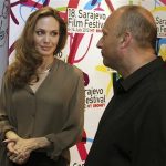 U.S. actress Angelina Jolie stands next to Mirsad Purivatra, director of the 18th Sarajevo Film Festival, before the festival July 7, 2012. REUTERS/Sarajevo Film Festival/Handout