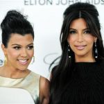 Television personalities sisters Kourtney and Kim Kardashian (R) arrive at the 20th annual Elton John AIDS Foundation Academy Awards Viewing Party in West Hollywood, California February 26, 2012. REUTERS/Gus Ruelas