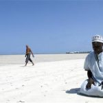 A Muslim man prays on a beach along the Indian Ocean town of Mombasa September 11, 2009, on the third Friday of the holy month of Ramadan. REUTERS/Joseph Okanga