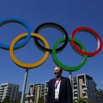 President of the International Olympic Commission, Jacques Rogge stands near Olympic rings during a tour of the Athletes Village at the Olympic Park in Stratford in east London July 23, 2012. REUTERS/Toby Melville