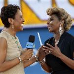 Singer Mary J. Blige speaks with ABC's Good Morning America host Robin Roberts (L ) before performing in New York's Central Park, June 22, 2012. REUTERS/Keith Bedford